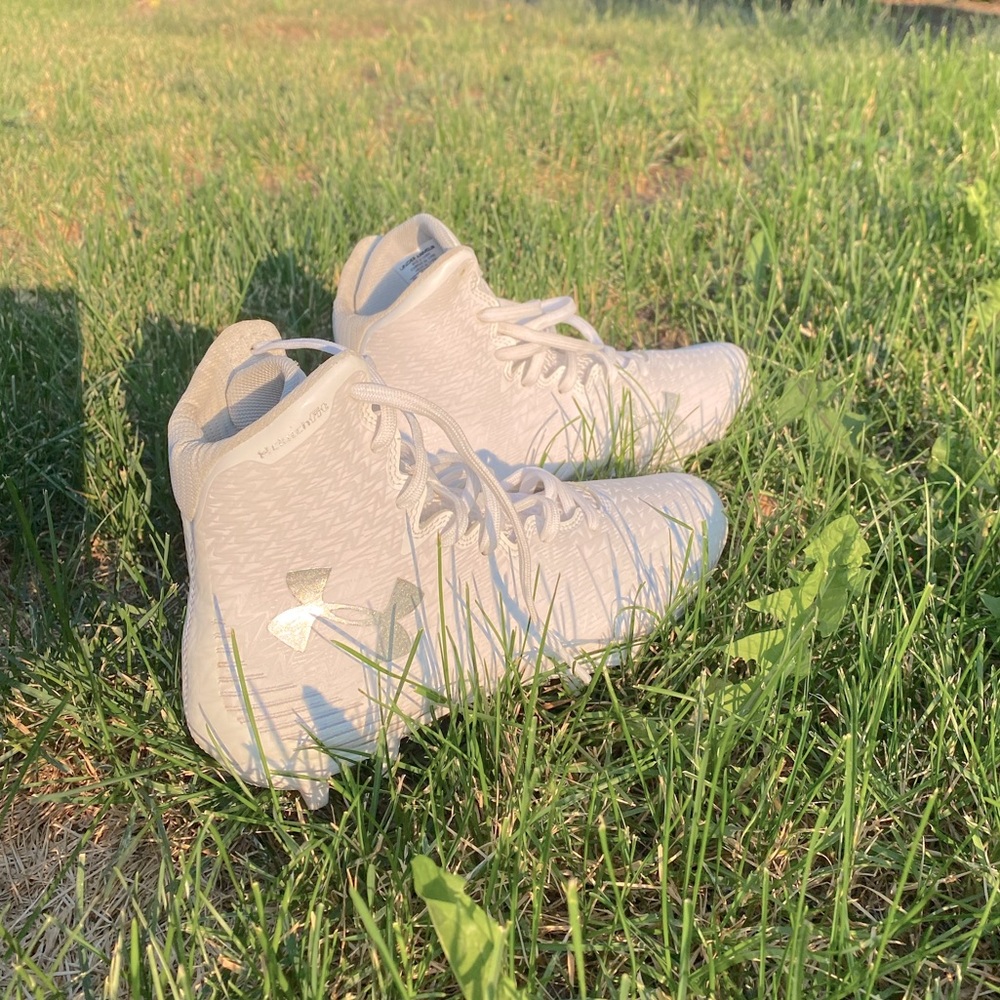 Women’s white Under Armor cleats